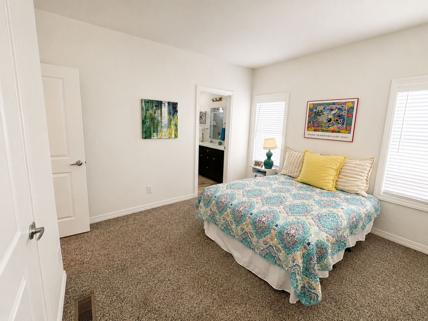primary bedroom with 2 large windows on either side of the bed